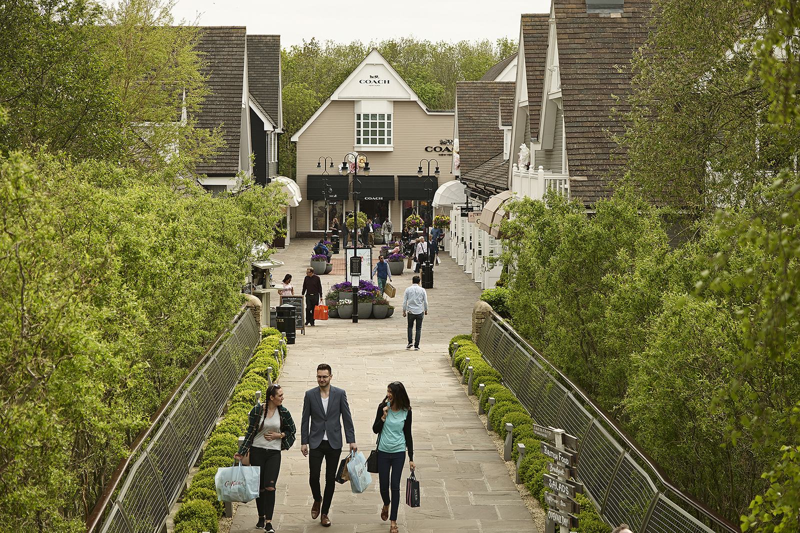 Shoppers on the walkway at Bicester Village.